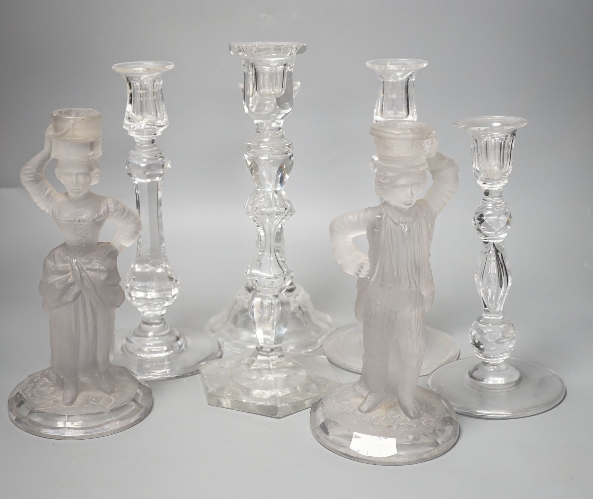Five various cut glass candlesticks, a pair of John Ford, Holyrood Glass Works, Edinburgh figural frosted glass candlesticks and a lustre drop bag chandelier